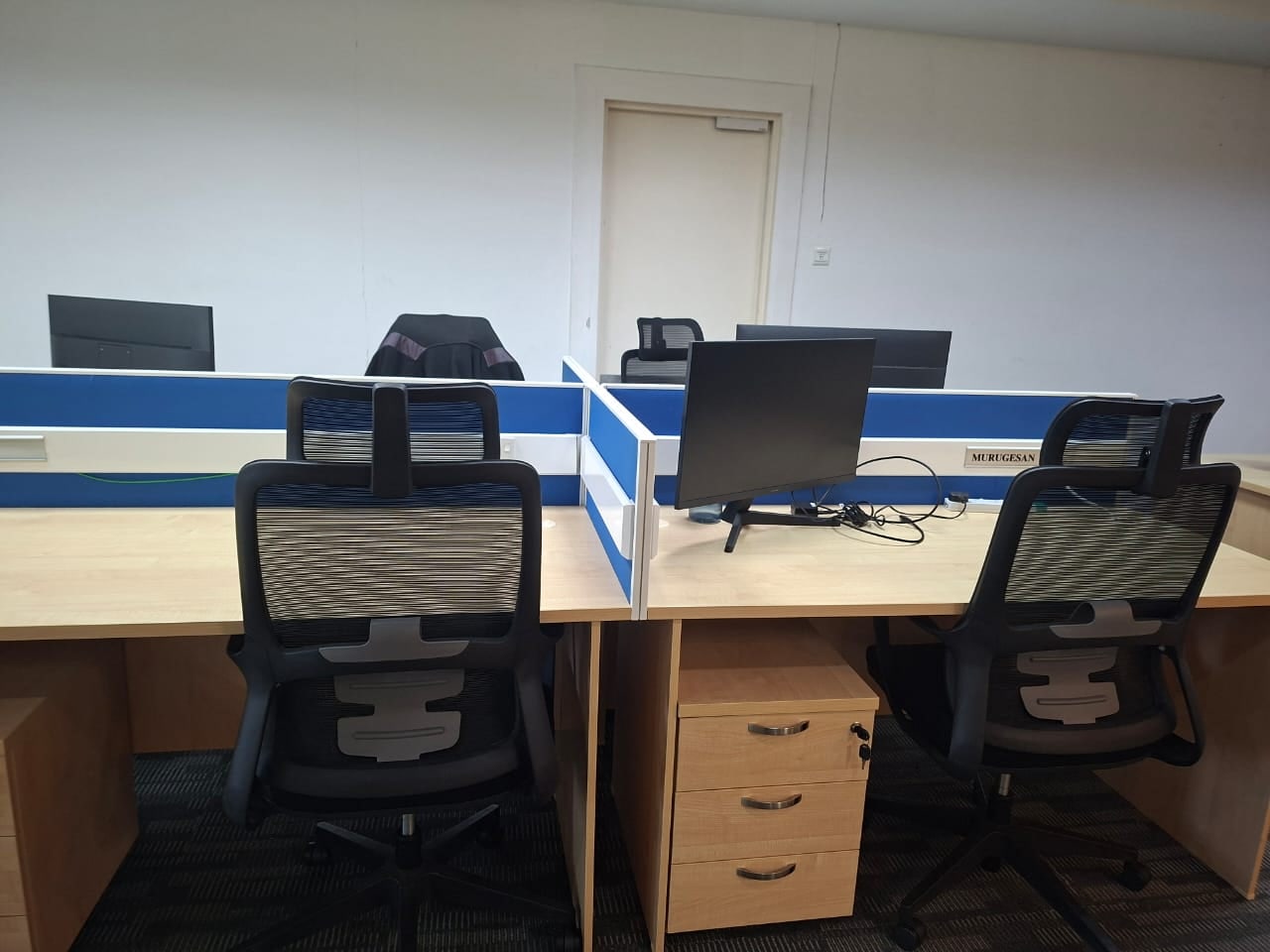 Workstations with blue desk partitions in a fitted Plaza Sentral office for rent, KL Sentral