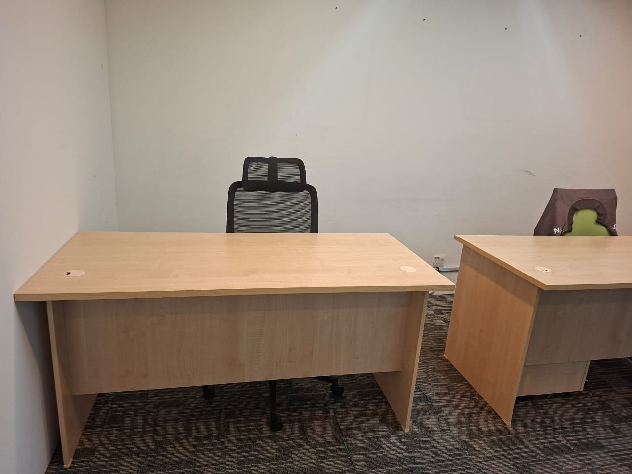 Timber desks and mesh office chairs in Plaza Sentral , a fitted KL Sentral office for rent