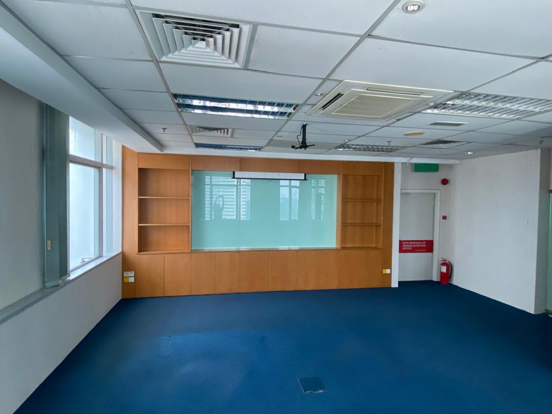 Fitted office room with timber display wall, screen and blue carpet at Plaza Sentral, KL Sentral.