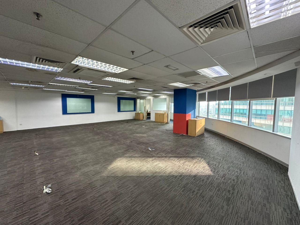 Open-plan carpeted workspace beside windows in a 3,927 sq ft fitted Plaza Sentral office for rent in KL Sentral.