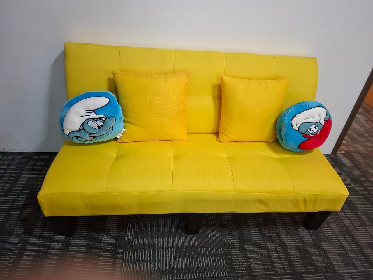Yellow sofa in the breakout area of Plaza Sentral office for rent, KL Sentral