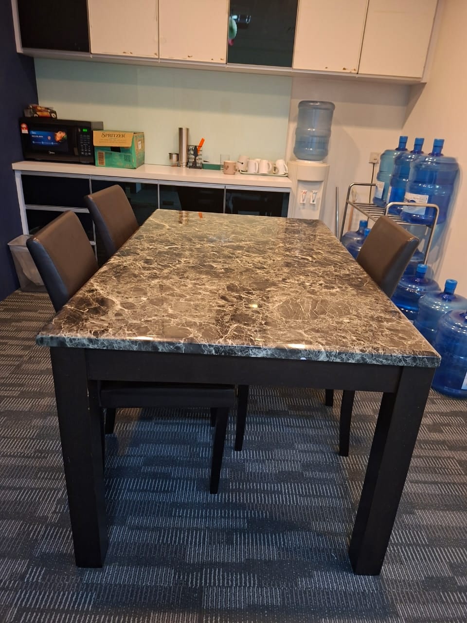 Office pantry with dining table, cabinets and water dispenser at Plaza Sentral for rent, KL Sentral