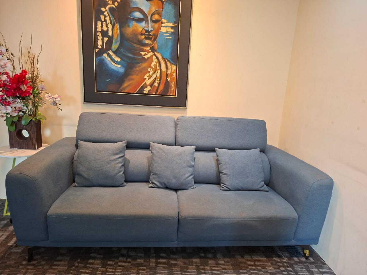 Grey sofa and wall artwork in the lounge of Plaza Sentral office for rent, KL Sentral